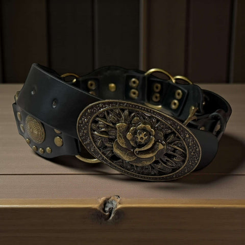Western floral buckle medallion wide belt in brown or black vegan leather with antique gold studs rivets and O-rings, adjustable buckle closure, 1 3/8 inch strap width