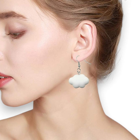white cartoon cloud drop earrings on model 
