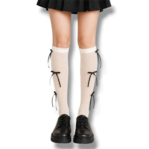 Knee High Socks with Long Bow Ribbons featuring ribbed knit texture and oversized satin bow details