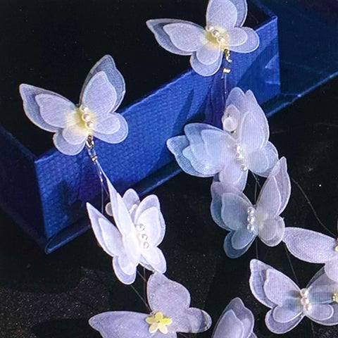 White Lace Butterfly Pearl Tassel Earrings with 3D lace wings, faux pearls, and long silver chain tassels