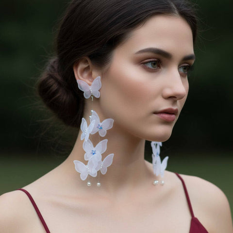 White Lace Butterfly Pearl Tassel Earrings with 3D lace wings, faux pearls, and long silver chain tassels