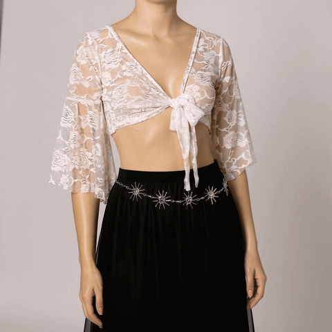 Woman wearing a white V Neck Front Tie Lace Bolero Cardigan