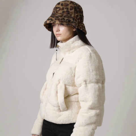 Woman wearing black label sherpa puffer winter coat side view of pockets