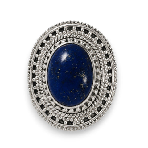 Handcrafted Lapis Lazuli sterling silver ring with oval blue gemstone and gold pyrite flecks front view white background