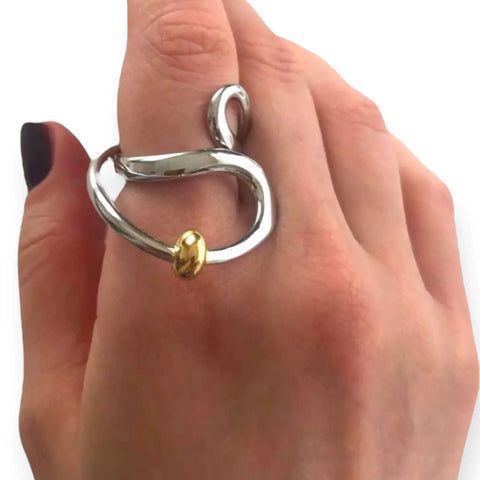 woman wearing Abstract Wavy Statement Ring with mixed metal silver and gold bead detail adjustable sculptural wrap design