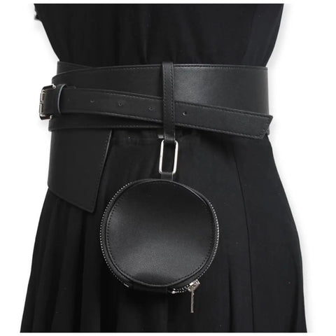 Asymmetric wide waist belt with detachable round mini bag styled over black dress