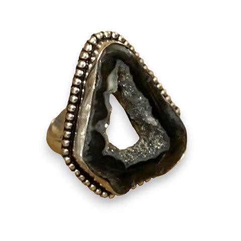 Artisan black spinel geode druzy agate statement ring on white background