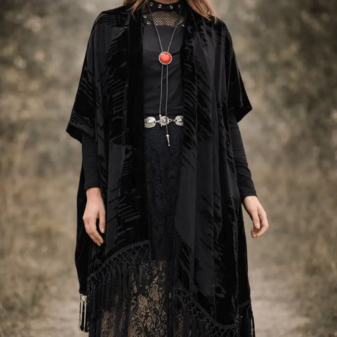 Black long fringe velvet duster jacket with wavy burnout texture, open-front kimono style, relaxed sleeves, and tassel hem for boho western festival layering regular-plus size