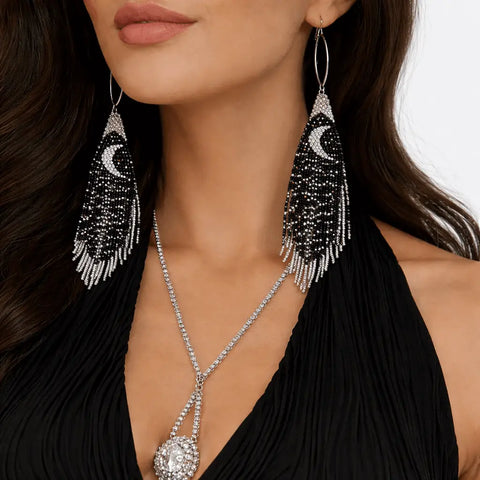 Black & Silver Moon Beaded Fringe Earrings worn by a model, showcasing their dramatic crescent moon and beaded design.