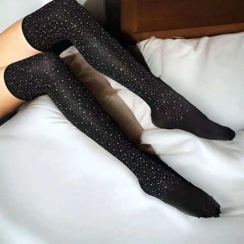 Black Sparkle Over The Knee Socks with opaque black stretch knit and multicolor rhinestone detailing from thigh to ankle, one size tall socks