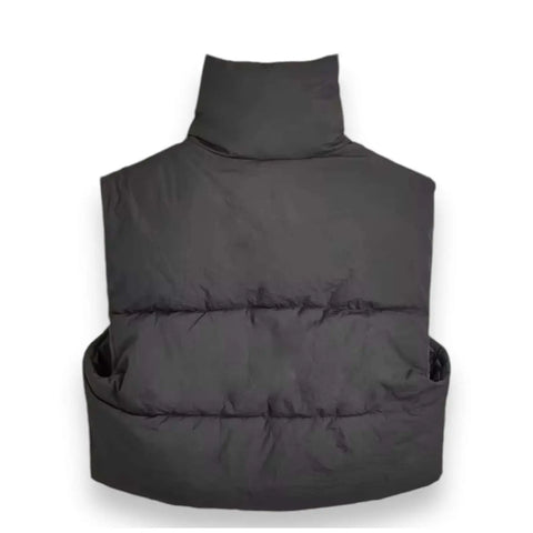 detail of tall stand collar on black puffer vest back view flat lay