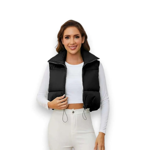 model wearing black cropped puffer vest with tall collar, open front white background