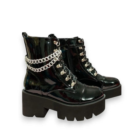 Black patent platform combat boots with silver D-rings, removable ankle chain and chunky lug sole