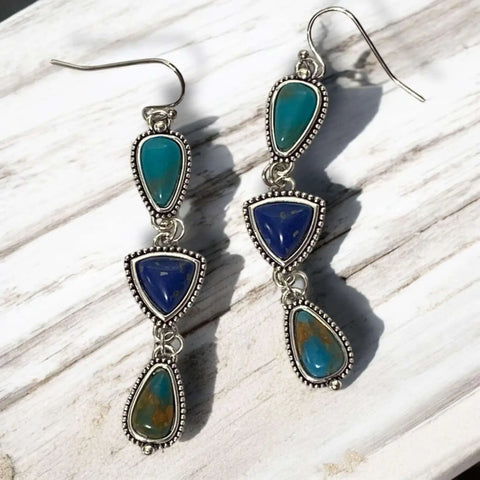 Boho western multi stone dangle earrings with turquoise and lapis style stones in braided silver settings.