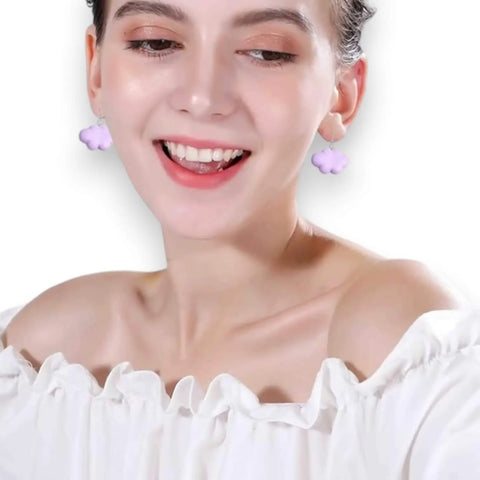 white cartoon cloud drop earrings on model 