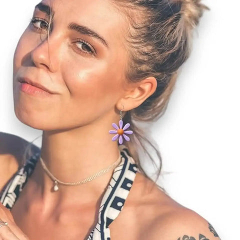 Colorful cartoon daisy drop earrings with acrylic flower charms and silver-tone fish hook / purple & orange