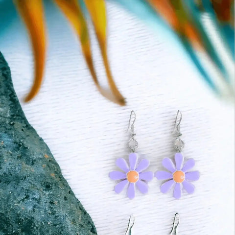 Colorful cartoon daisy drop earrings with acrylic flower charms and silver-tone fish hook / purple & orange