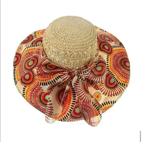Colorful crochet wide brim straw sun hat with raffia crown and vibrant fabric brim in boho, Y2K, and retro prints for summer sun protection