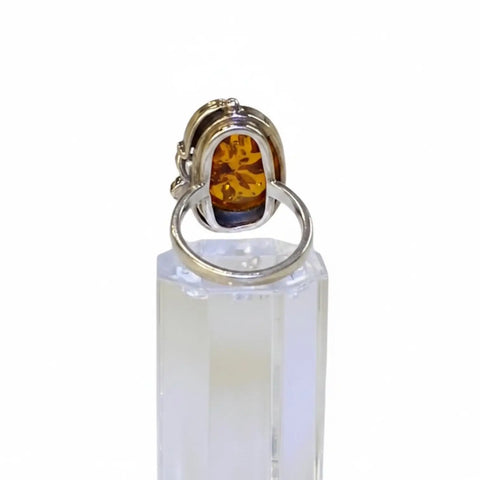 Women's Custom Sterling Silver Amber Ring with pear-shaped Baltic amber and grapevine leaf setting / 7