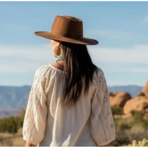 woman wearing Dark Brown Cordobes Fedora Hat with flat round crown, stiff wide brim, and coco brown felt blend finish