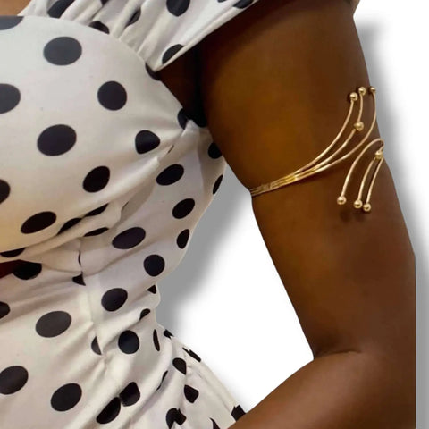 Elegant Boho Adjustable Arm Cuffs showcased on a model wearing a polka dot top, highlighting festival-ready style.