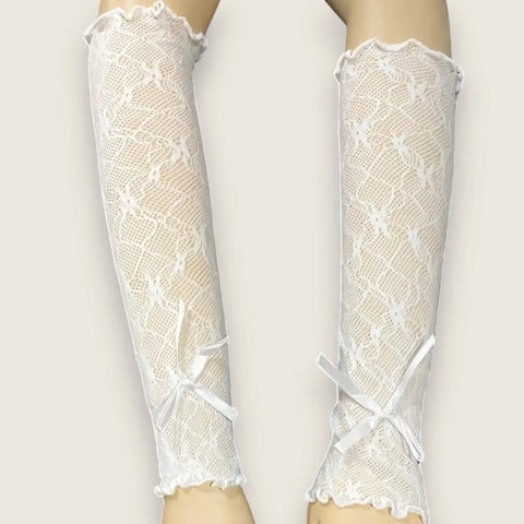 Elegant long lace arm cover gloves in black or white with floral texture, ruffled trim and stretch fit