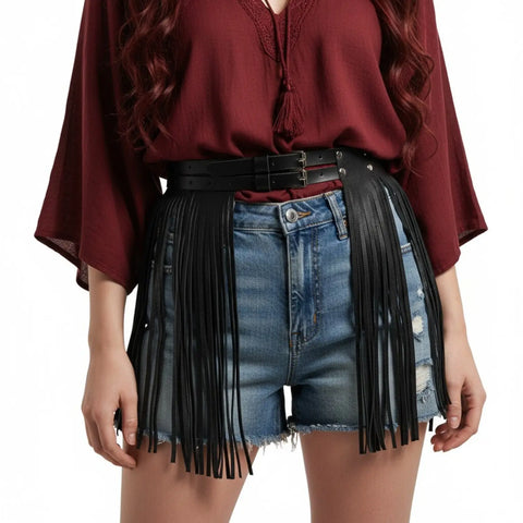 Black faux leather skirt fringe belt with dual buckles, studded accents, and long tassel fringe