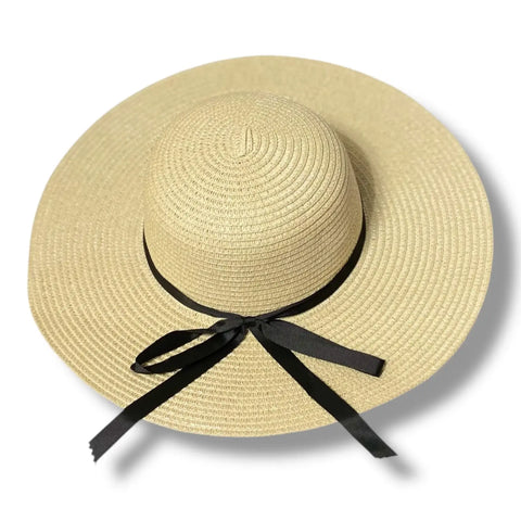 Floppy wide brim straw sun hat with black ribbon band, sustainable braided straw, boho chic summer fashion.