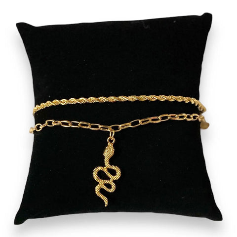 Gold Charming Snake Rope Anklet Bracelet Set of 2 displayed on a black cushion, showcasing twisted rope and paperclip chain designs.