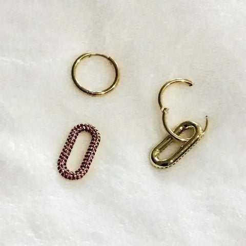 flat lay of front and back click open hoop front and back side of oval links