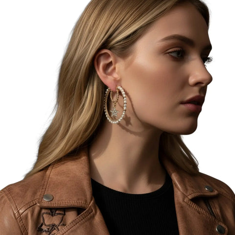 Gold multi-ring hoop earrings with faux pearls, rhinestone stars and layered celestial crystal details