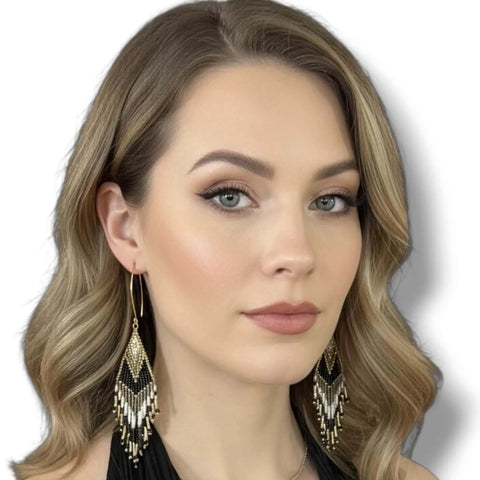 Handmade black gold beaded fringe earrings with a tribal diamond weave pattern and long shoulder duster tassels.