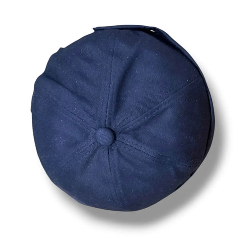 flat lay Harbour Cotton Docker No Brim Cap in navy rolled edge, eyelets, button top, and adjustable strap osfm / unisex