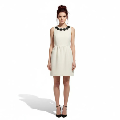 Ivory sleeveless Kensie shift dress with black floral neckline appliqué and exposed silver-tone back zipper