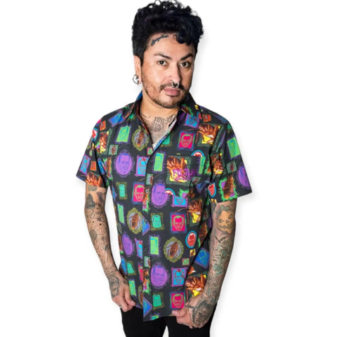 John Waters graphic camp shirt in 100% cotton with all-over portrait print and pink embroidered pocket logo. Short sleeve button-up relaxed fit. Size XXL.
