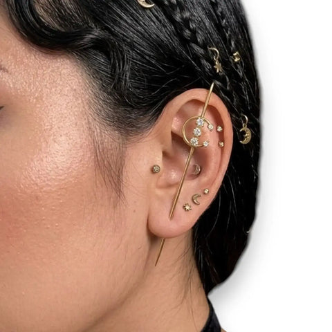 woman wearing gold Lunar Moon Star Ear Hook Pins with crystal crescent moon, star charms, and gold or silver ear crawler style