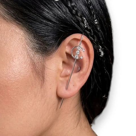 woman wearing silver Lunar Moon Star Ear Hook Pins with crystal crescent moon, star charms, and gold or silver ear crawler style