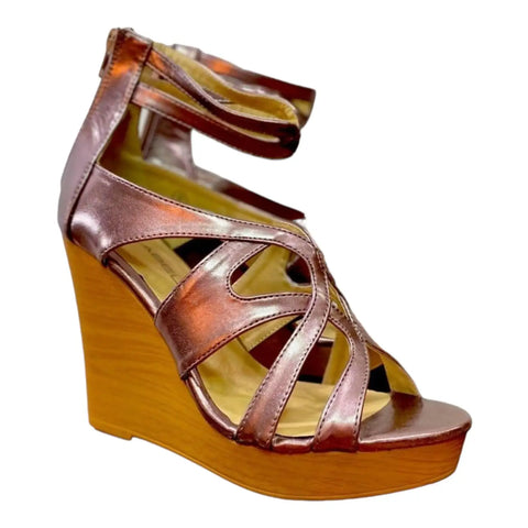 Metallic pink strappy open toe wedge sandals with ankle buckle and back zipper side view