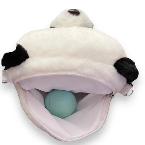 Movin Panda Bear Crossbody Bag open with a blue ball inside, showcasing its fluffy panda design and storage space.