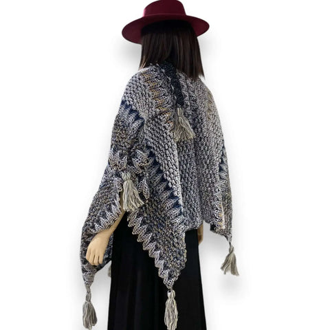 mannequin wearing gray blue Multicolor Knit Poncho Wrap with colorful loom-knit pattern and large tassels