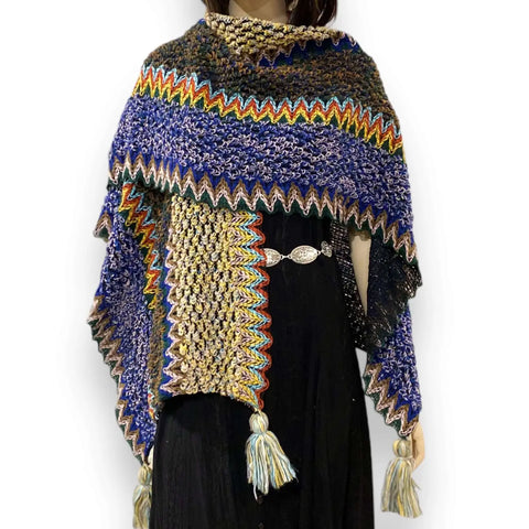 woman wearing Multicolor Knit Poncho Wrap with colorful loom-knit pattern and large tassels