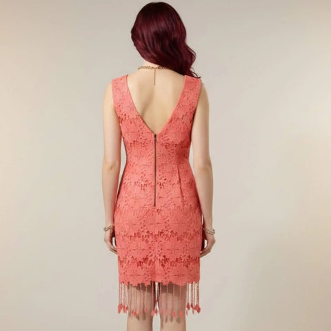 Peach Blossom Sleeveless Floral Fringe Mini Dress with 3D floral appliqué, V-neckline, and tassel hem front side modeled