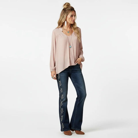 Pink Ruffle V-Neck Long Sleeve Blouse in soft pink rayon with frill neckline, gathered cuffs, and hi-low hem model wearing medium