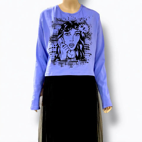 model wearing plus size blue delia’s style long sleeve graphic tee