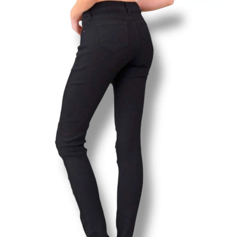 Plus size mid rise black ripped skinny jeans with distressed detail and triple button closure