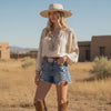 Beige Round Top Wide Brim Fedora with flat crown, brown faux leather band, and structured boho western brim