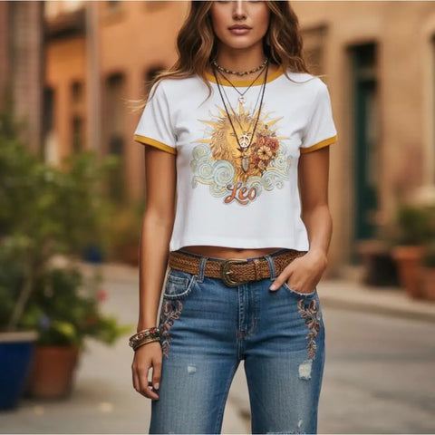 loyal lioness short sleeve graphic leo baby tee with sunburst lion print white crop top with tan contrast trim 