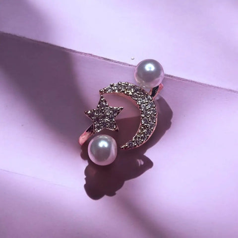 Adjustable silver celestial wrap ring with rhinestone moon, star, and faux pearl details – perfect for boho and cosmic-inspired fashion.