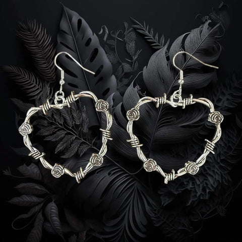 silver thorn floral open heart dangle earrings with barbed wire style edges and fish hook closure gothic boho y2k jewelry
