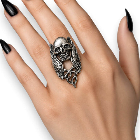 woman wearing  on middle finger Silver Winged Skull Serpent Ring with antique silver skull, wings, and serpent detail ring sizes 9 10 11